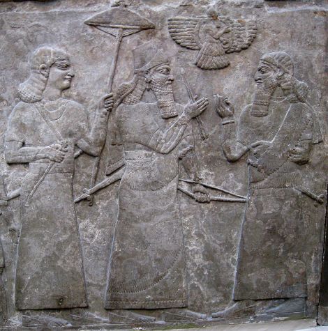 Ashurnasipal_with_official - Ashur-nasir-pal II (centre) meets a high official after a successful battle.