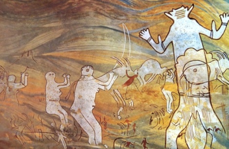 Rock painting depicting the Great God of Sefar, one of the most overwhelming of the Tassili pictures. In the centre a hugh faceless figure over ten feet high. On the left women raise their arms in supplication; on the right another woman with a swollen abdomen seems about to give birth. (Photo by: Universal History Archive/UIG via Getty images)